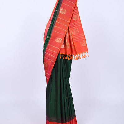 Green soft silk saree with zari buttas, contrast border of peacocks & pallu of kathir,neli,mayil & butta enclosed checks