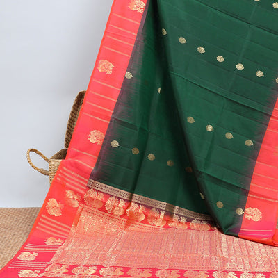 Green soft silk saree with zari buttas, contrast border of peacocks & pallu of kathir,neli,mayil & butta enclosed checks