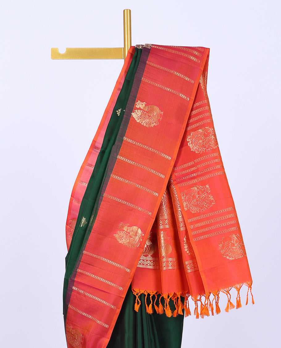 Green soft silk saree with zari buttas, contrast border of peacocks & pallu of kathir,neli,mayil & butta enclosed checks
