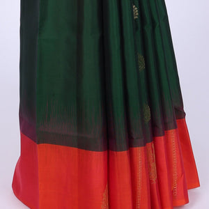 Green soft silk saree with zari buttas, contrast border of peacocks & pallu of kathir,neli,mayil & butta enclosed checks