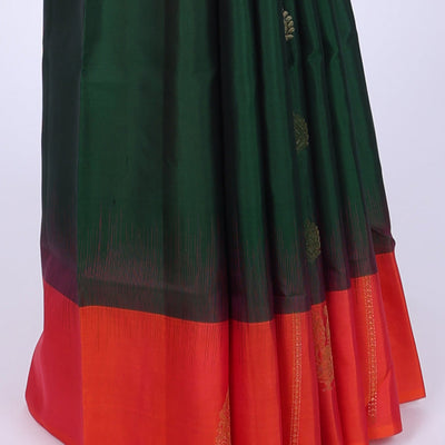 Green soft silk saree with zari buttas, contrast border of peacocks & pallu of kathir,neli,mayil & butta enclosed checks