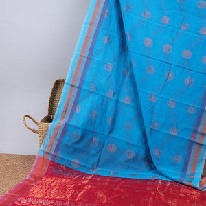 Blue silk cotton saree with buttas, contrast striped border & pallu of floral designs