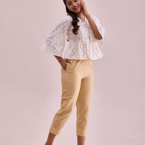 Women Solid Light Gold Mid Rise Cropped Metallic Pants