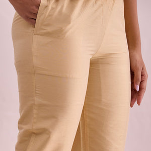 Women Solid Light Gold Mid Rise Cropped Metallic Pants