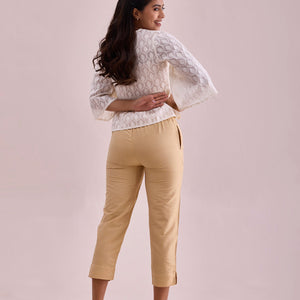 Women Solid Light Gold Mid Rise Cropped Metallic Pants