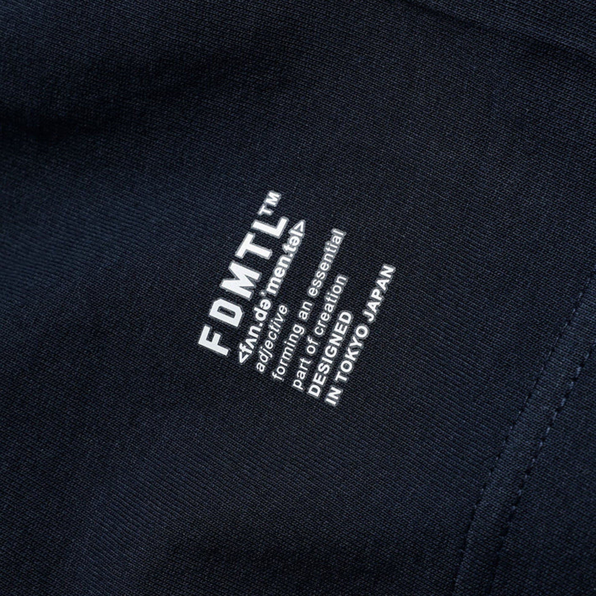 FDMTL | CIRCLE PATCH TEE { NAVY