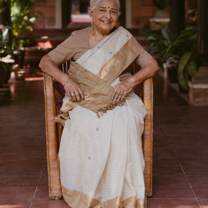 White Handloom Village Cotton Saree With Cross buttas in Red and Black