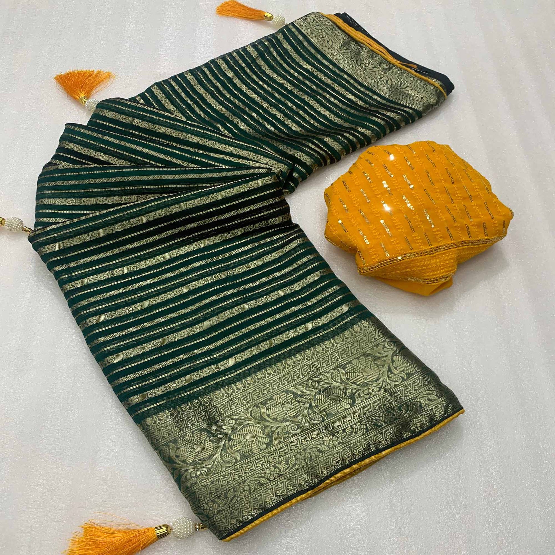 Dark Green Woven Georgette Saree With Tassels