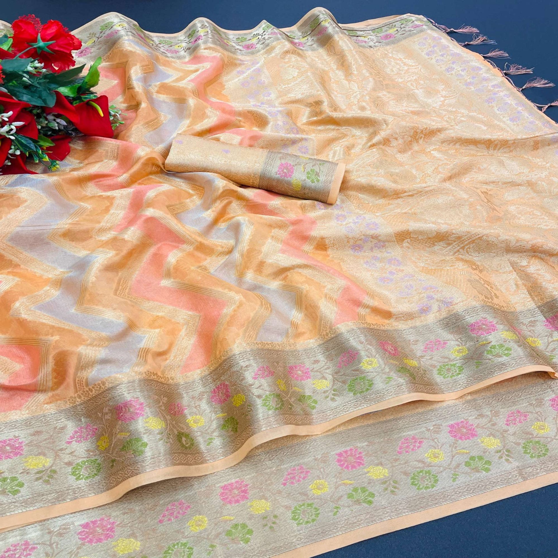 Light Orange Woven Organza Saree With Tassels