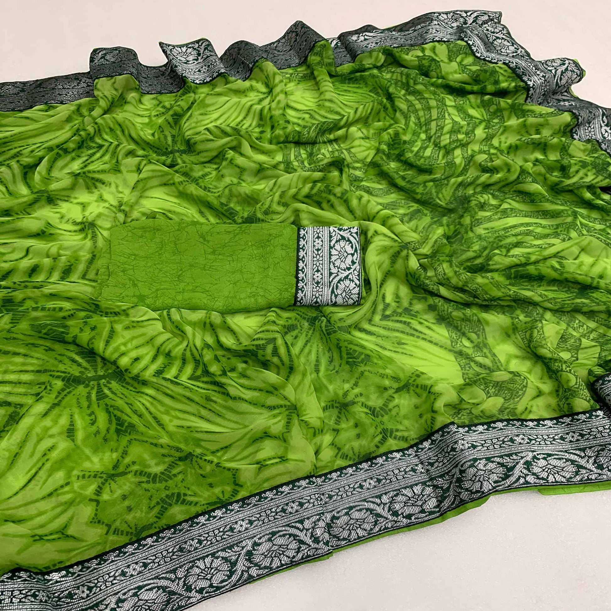 green-shibori-printed-georgette-saree-with-woven-border