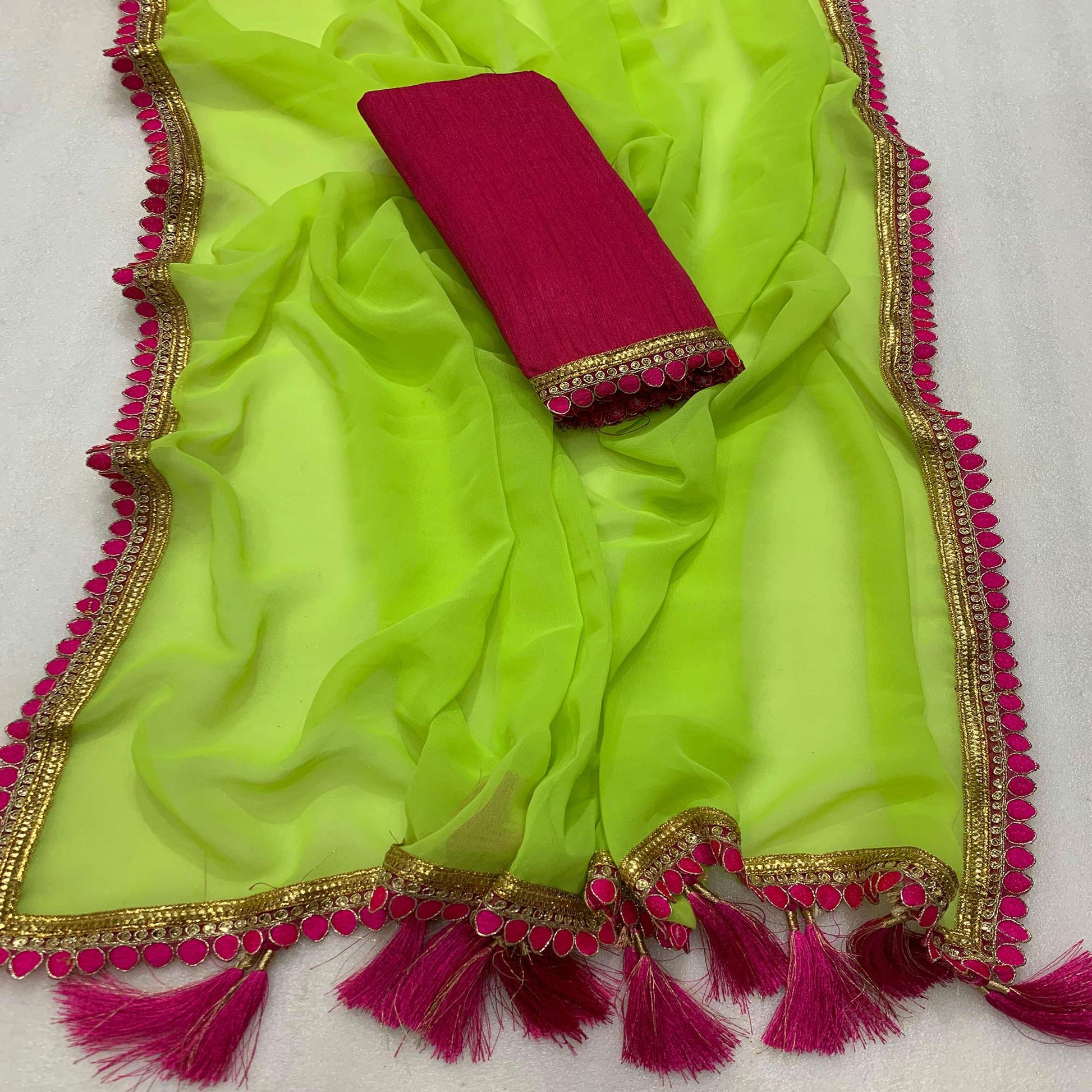 green-solid-georgette-saree-with-embroidered-lace-border-tassels