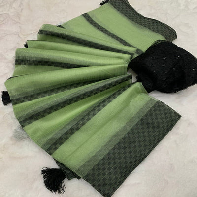 green-woven-net-saree-with-tassels