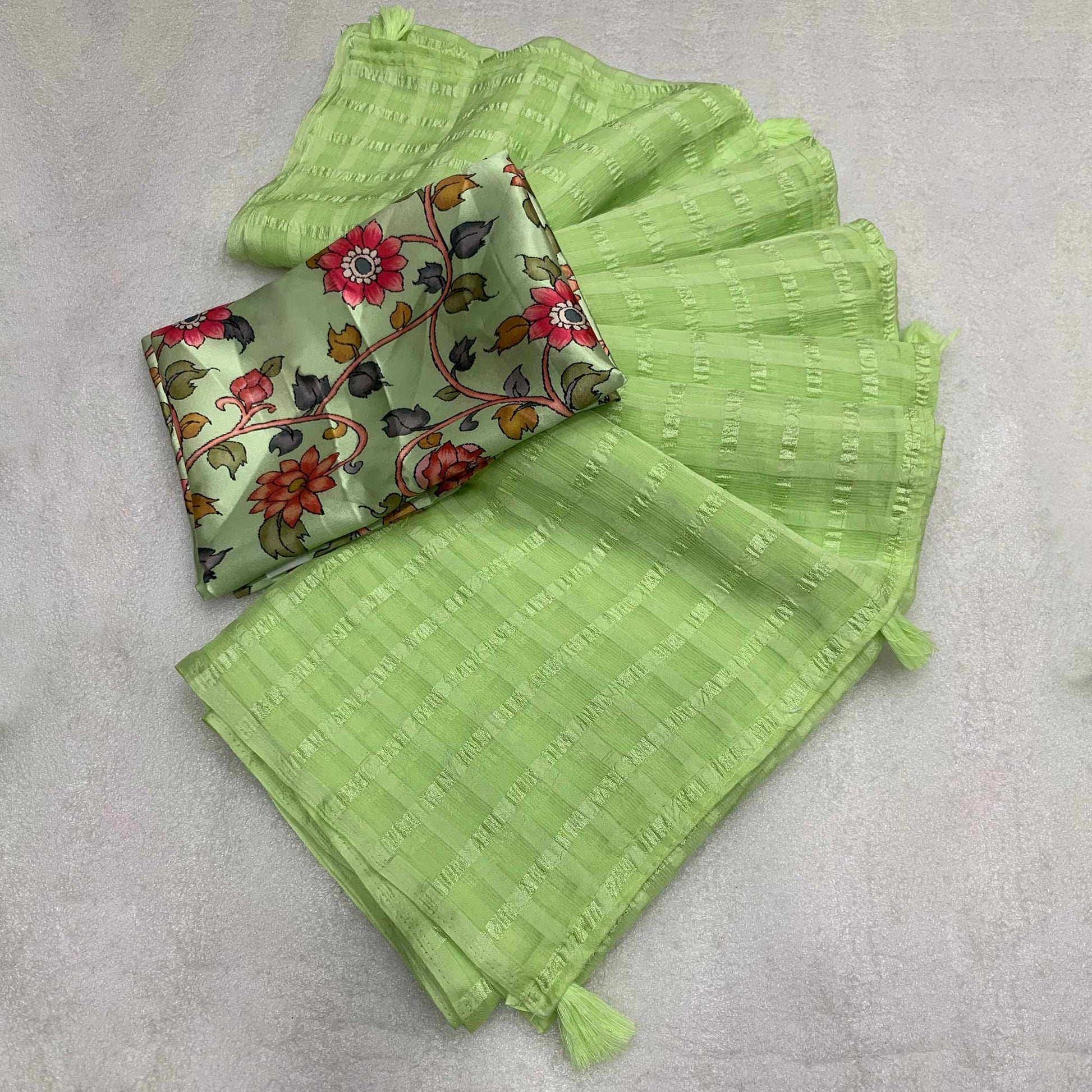 green-woven-chiffon-wrinkle-saree-with-tassels