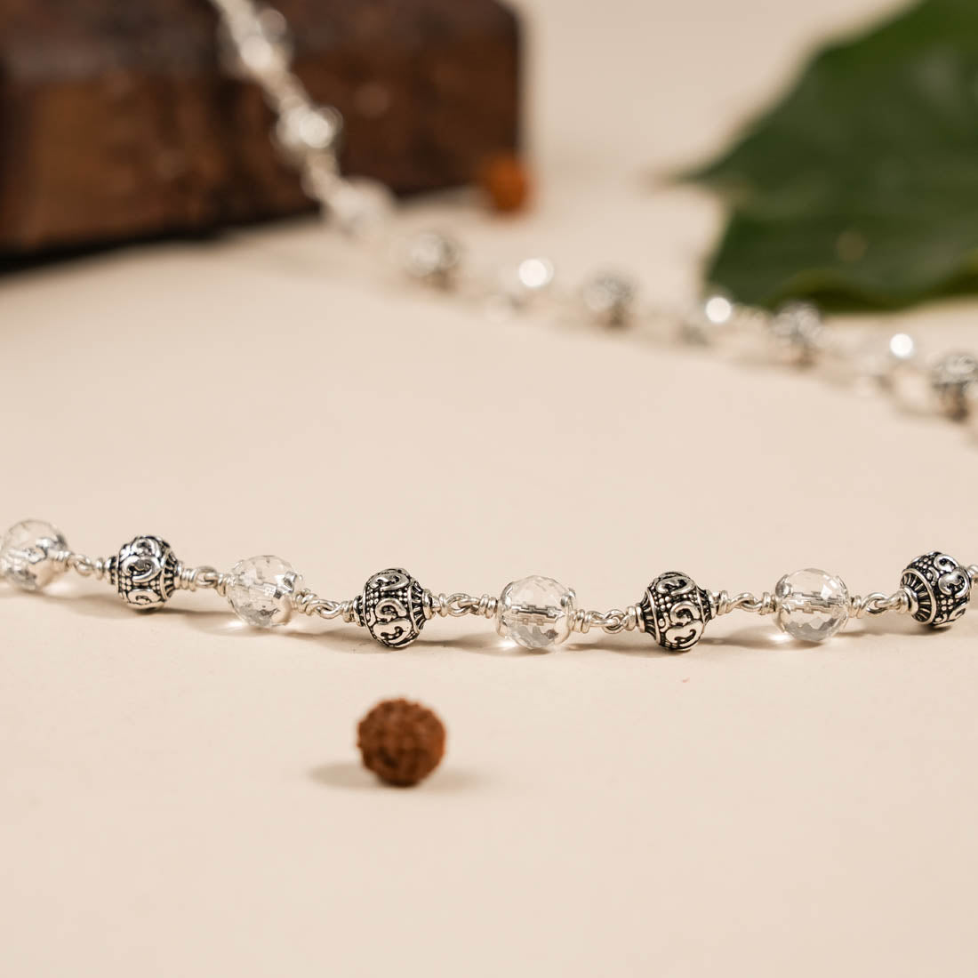 SPHATIK DIAMOND CUT BEADS WITH OM SILVER BEADS MALA