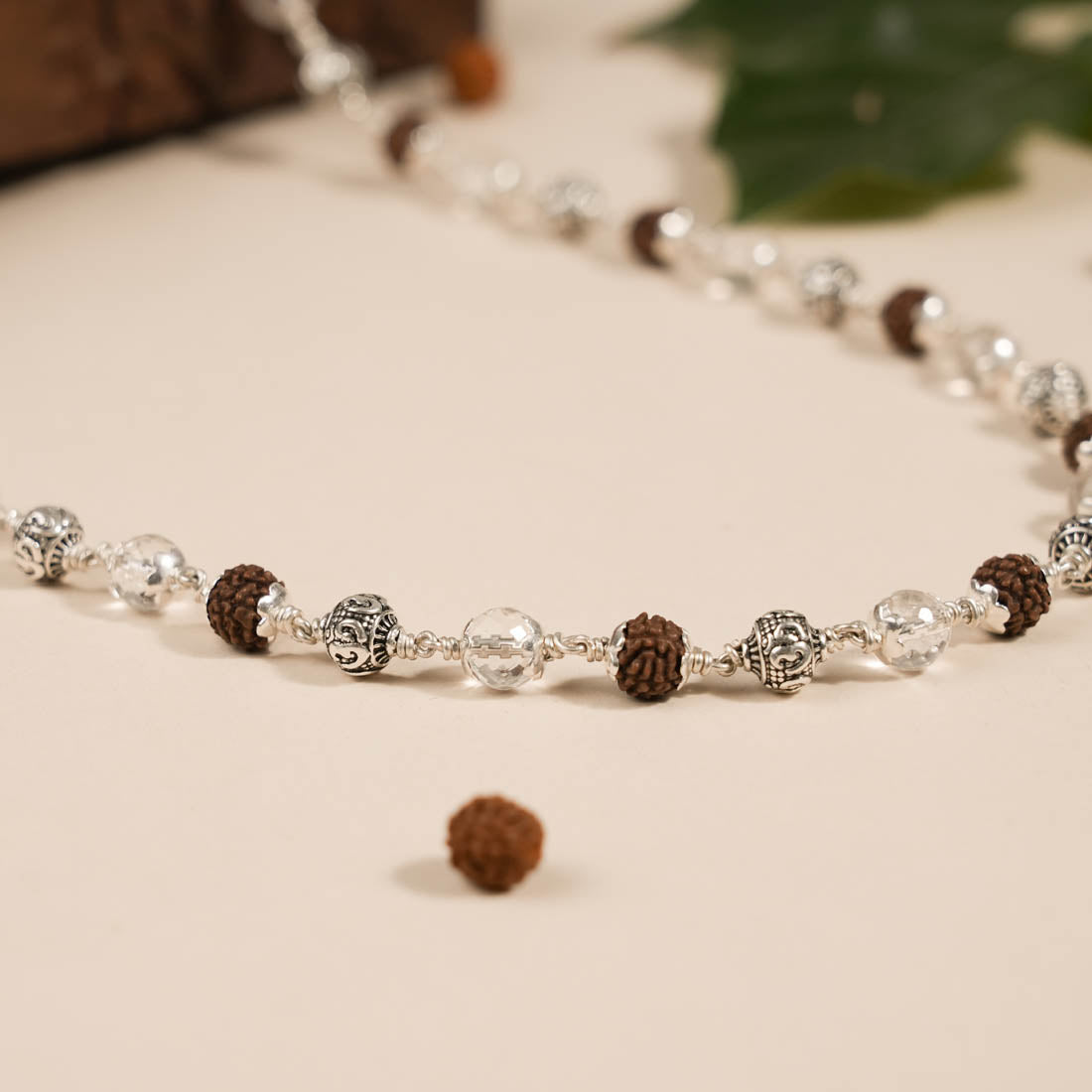 RUDRAKSHA WITH SPHATIK DIAMOND CUT AND OM SILVER BEADS MALA