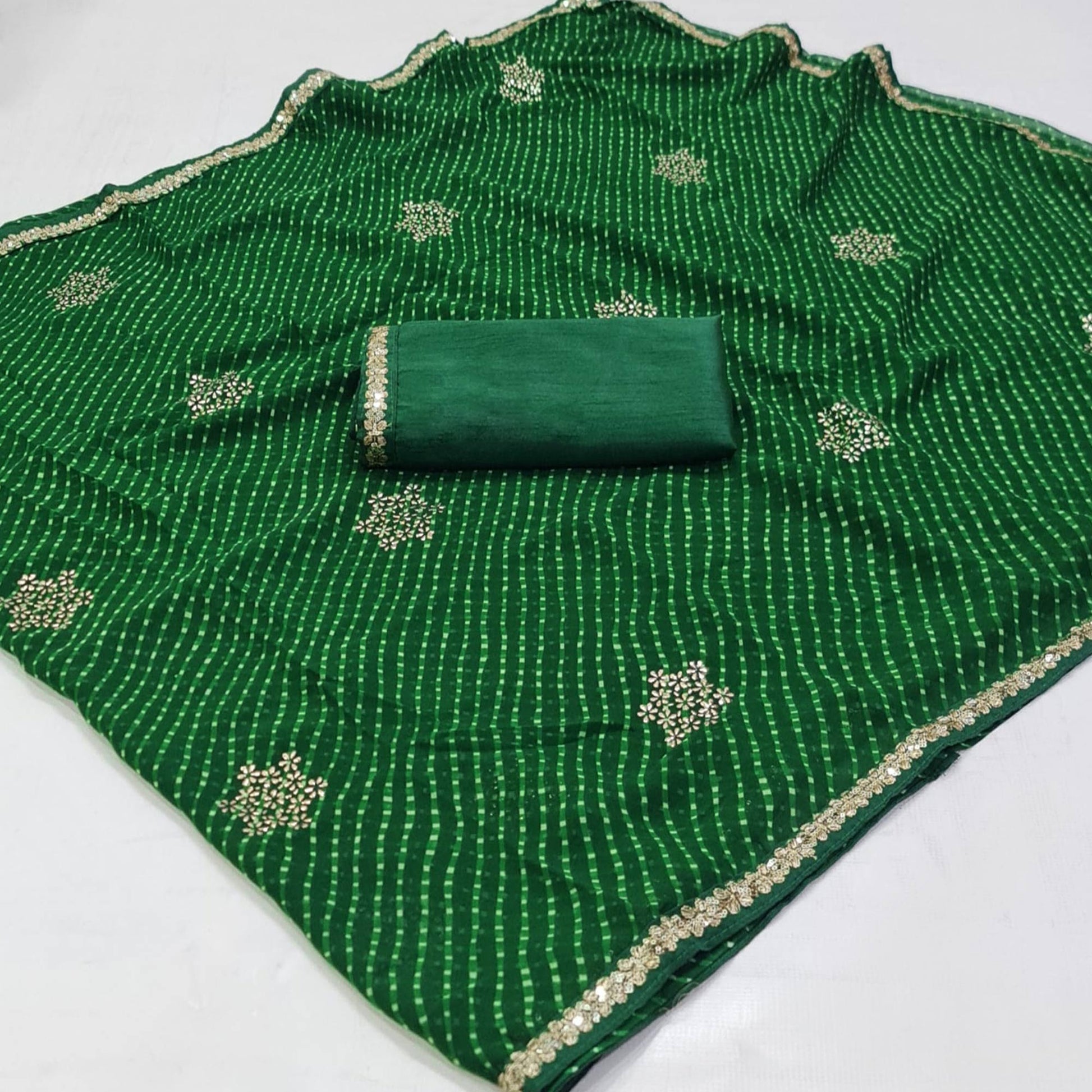 Dark Green Printed Georgette Saree With lace Border