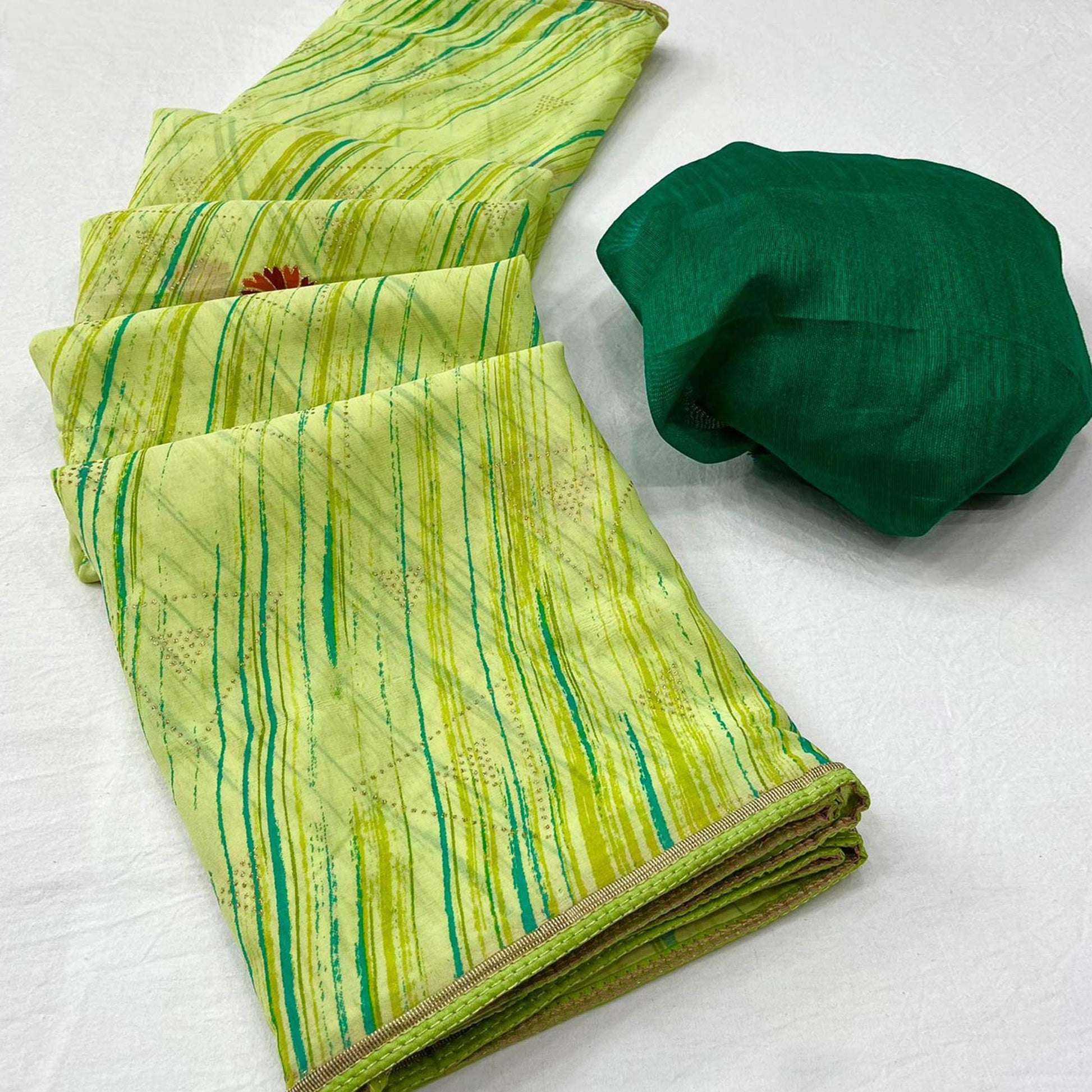 a-green-printed-raw-silk-saree-with-fancy-border