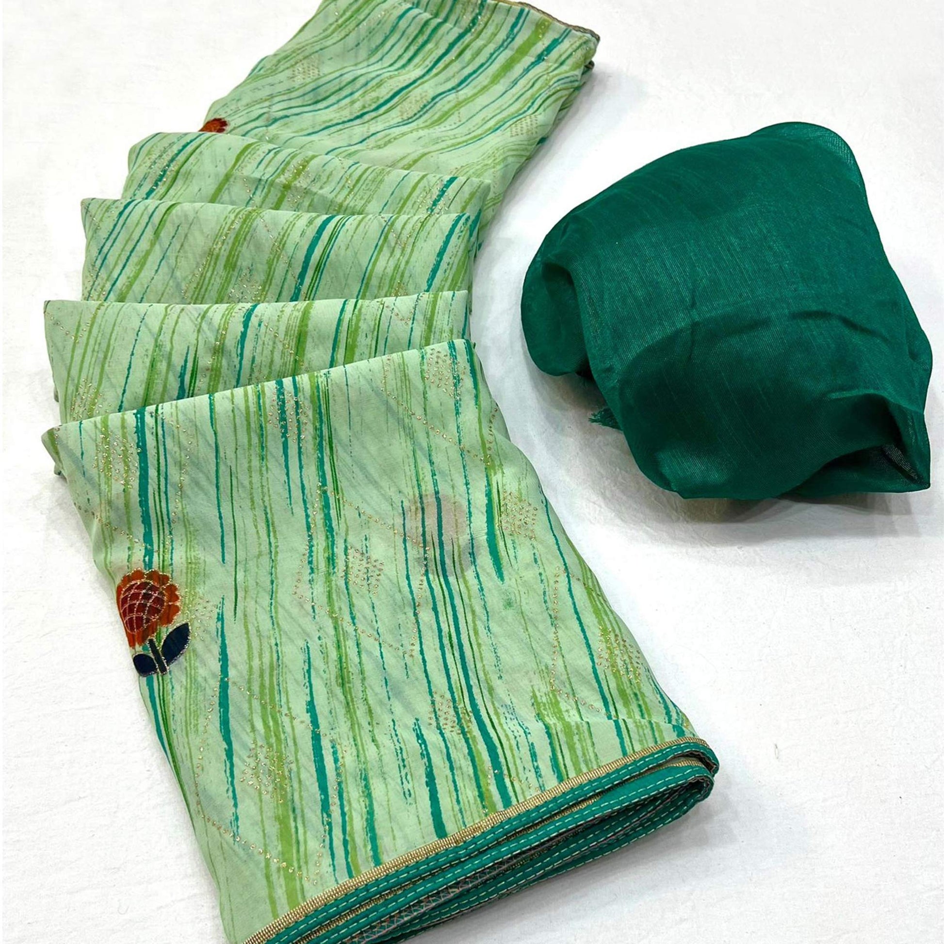 green-printed-raw-silk-saree-with-fancy-border