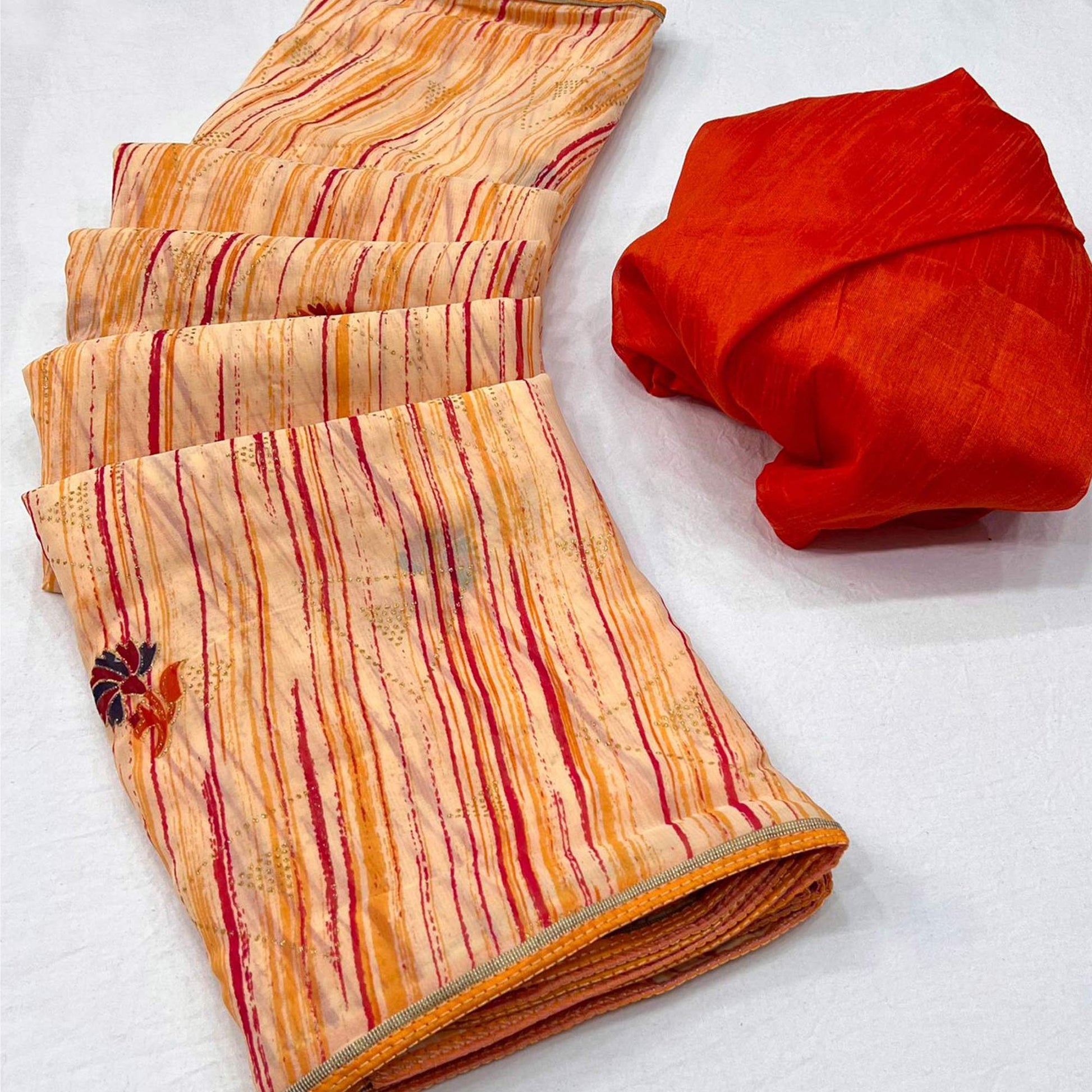 Light Orange Printed Raw Silk Saree With Fancy Border