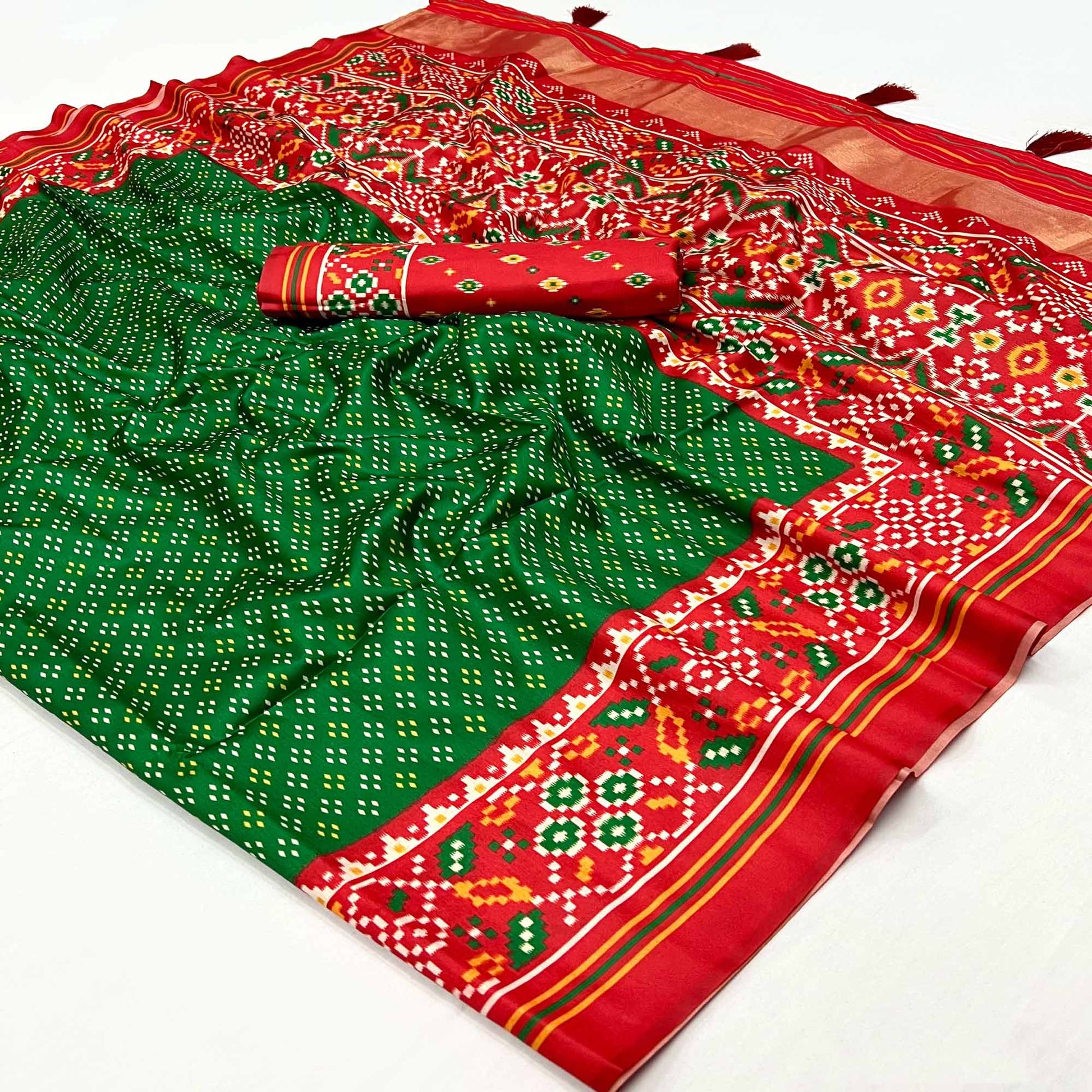 green-patola-printed-tussar-silk-saree-with-tassels