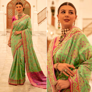 green-patola-printed-banarasi-silk-saree-with-tassels