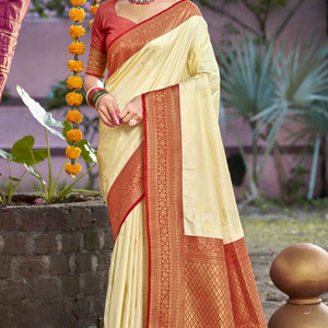Cream Floral Woven Banarasi Silk Saree With Tassels