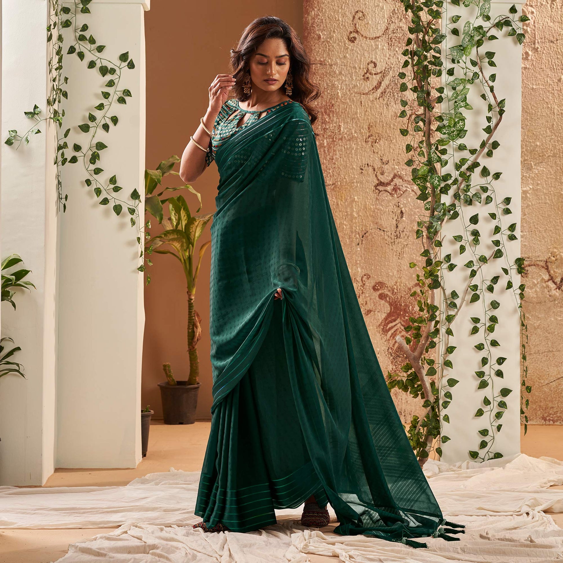 Dark Green Woven Georgette Saree With Tassels