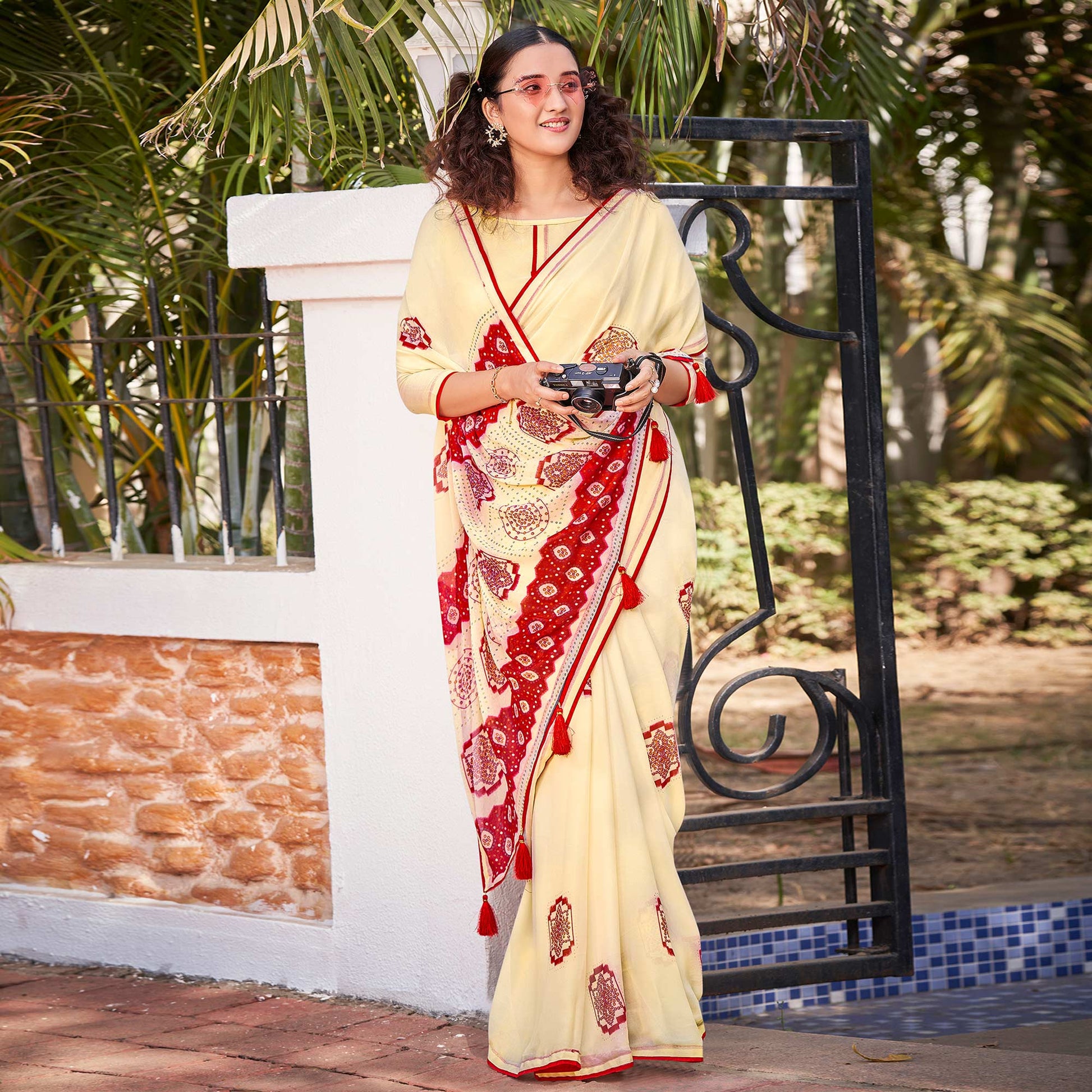 Cream Foil Printed Georgette Saree With Tassels