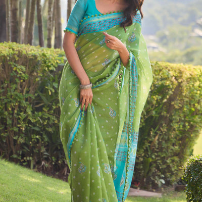 green-printed-cotton-blend-saree-with-pumpum-lace-1