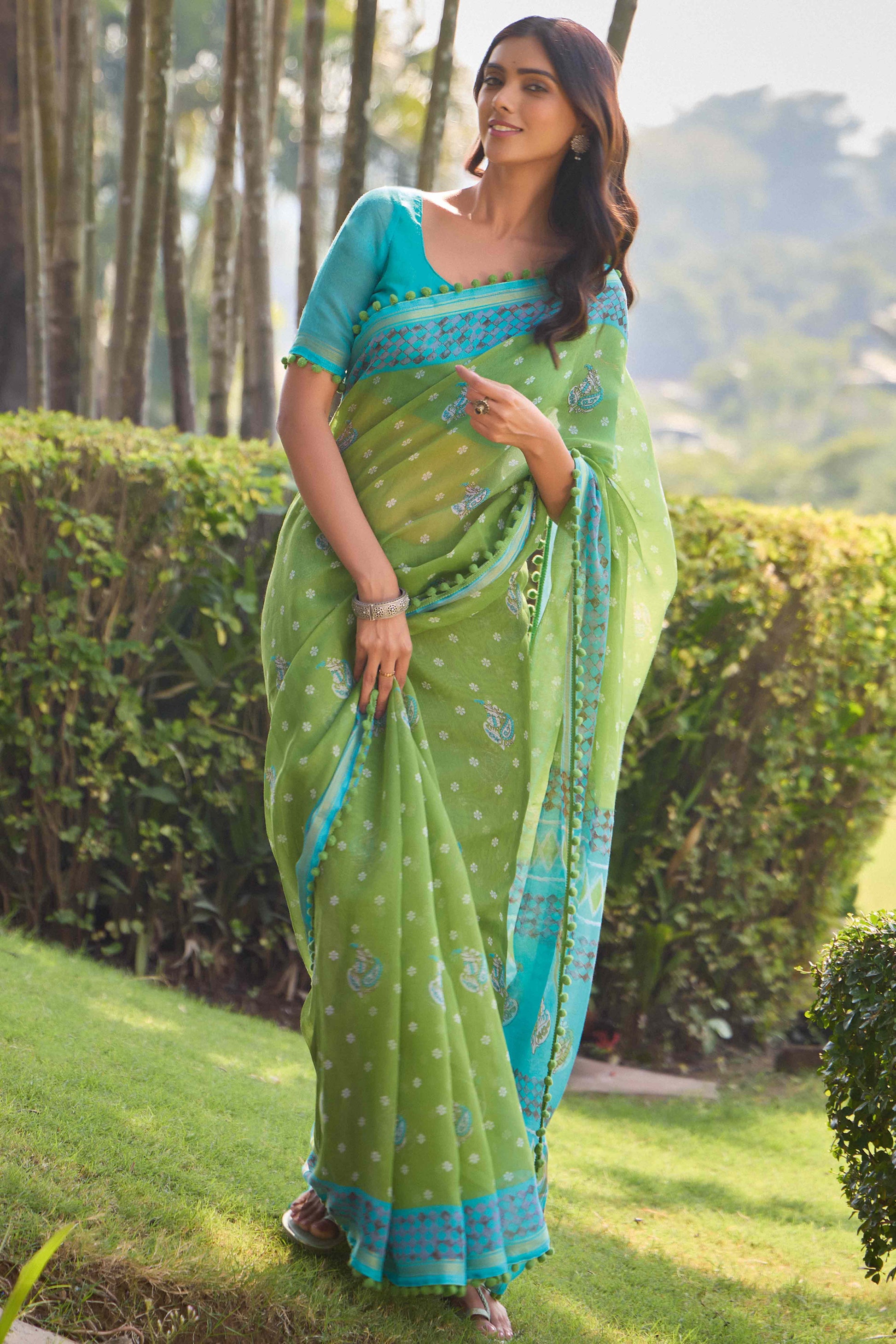 green-printed-cotton-blend-saree-with-pumpum-lace-1