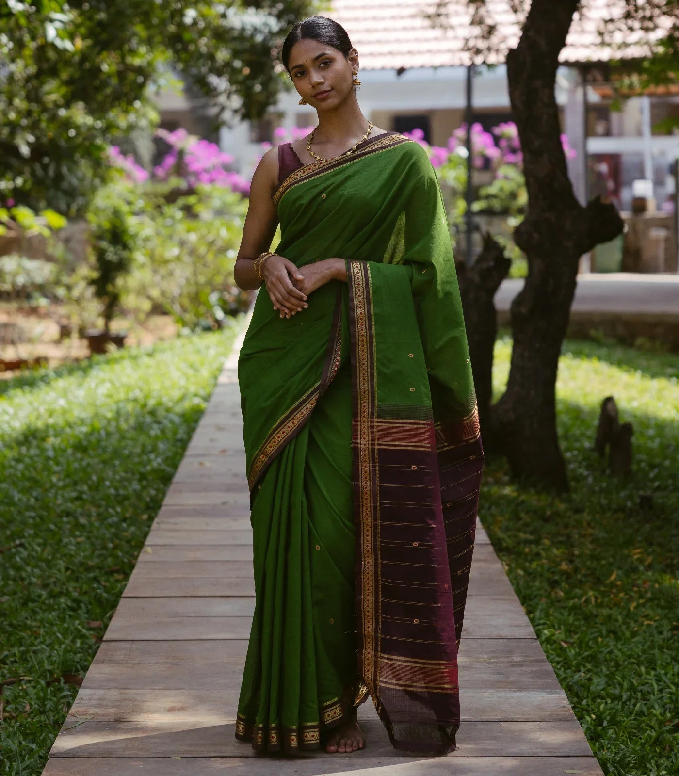 Green Handloom Kadapa cotton saree adorned with red Meenakari buttis