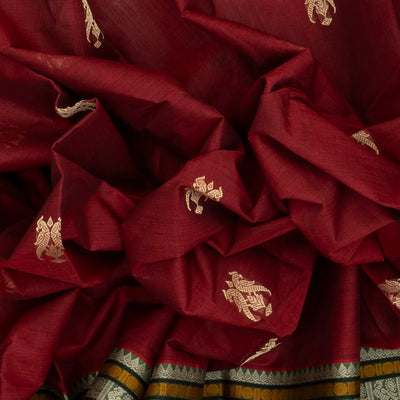 Crimson Handloom Kanchi Cotton Saree With Parrot Buttas.