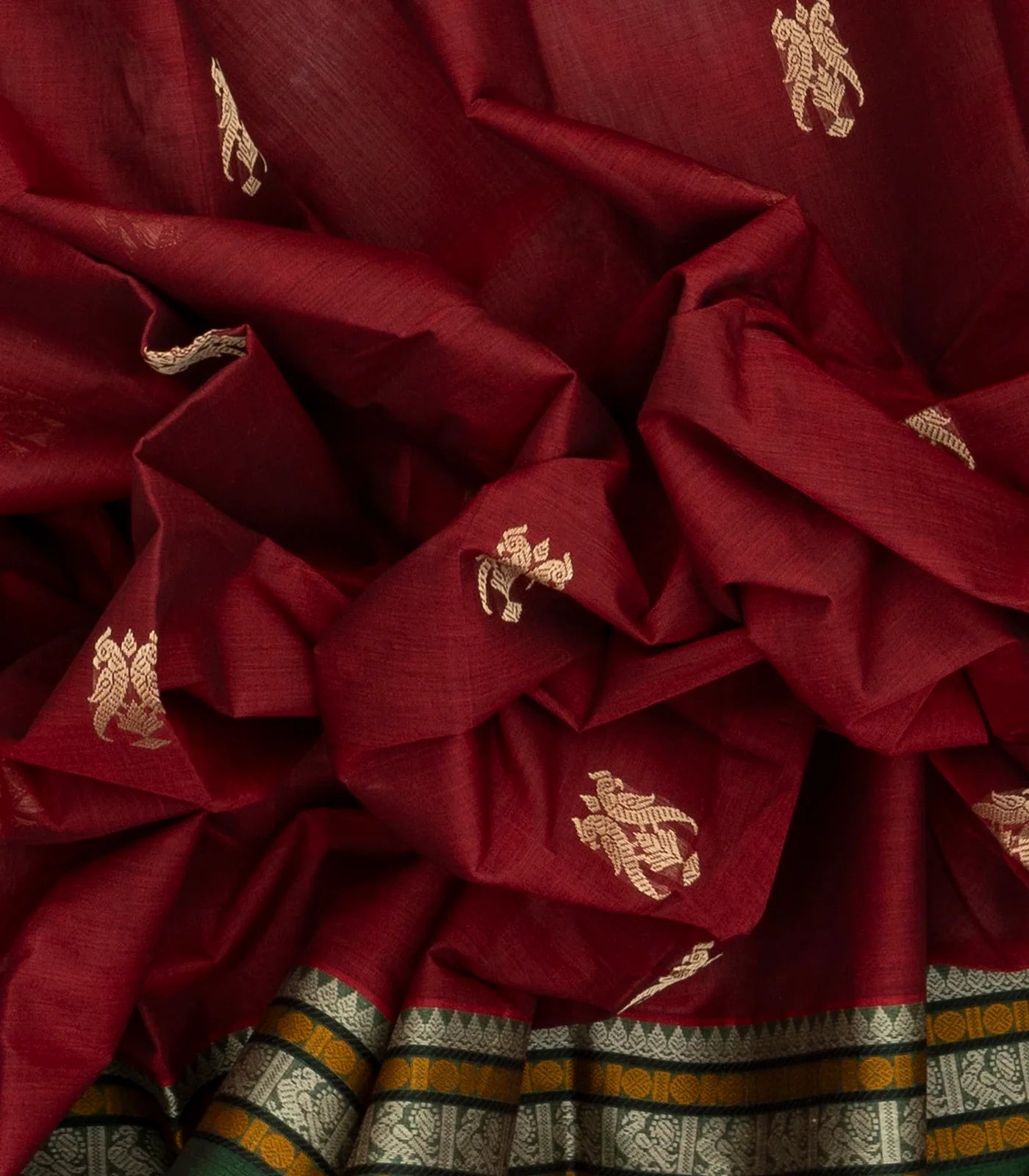 Crimson Handloom Kanchi Cotton Saree With Parrot Buttas.