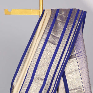 Cream Semi banaras tissue saree with contrast traditional zari border & pallu of intricate design
