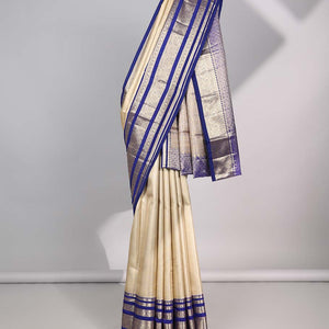 Cream Semi banaras tissue saree with contrast traditional zari border & pallu of intricate design