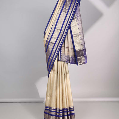 Cream Semi banaras tissue saree with contrast traditional zari border & pallu of intricate design