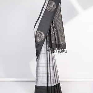 Grey checked Mayur soft silk saree with contrast leaf motifs border & argyle pattern pallu