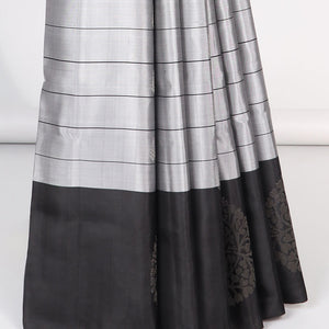 Grey checked Mayur soft silk saree with contrast leaf motifs border & argyle pattern pallu