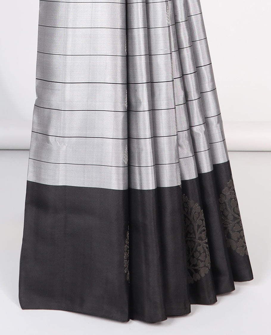 Grey checked Mayur soft silk saree with contrast leaf motifs border & argyle pattern pallu