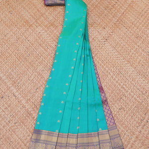 Blue vasundhara silk mix saree with buttas, contrast jaal pallu & traditional design zari border