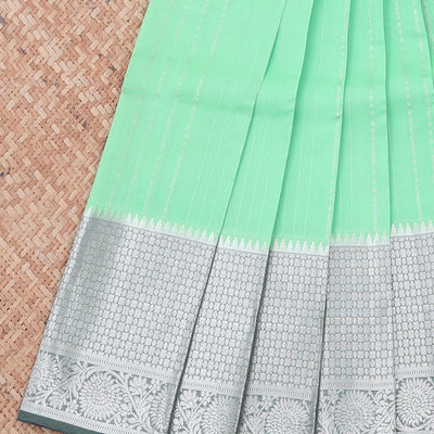 Green vasundhara silk mix saree with zari designs, contrast jaal pallu & traditional design zari border