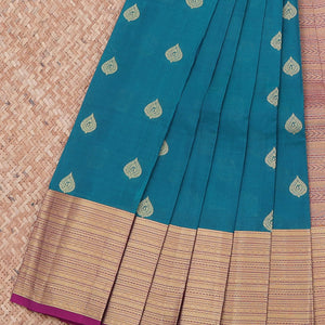 Blue vasundhara silk mix saree with buttas, contrast border & pallu steeped with traditional designs