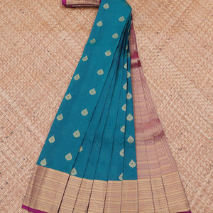 Blue vasundhara silk mix saree with buttas, contrast border & pallu steeped with traditional designs