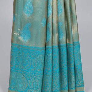 Blue paisley design Semi banaras tissue saree, border of embellished paisley motifs & intricate pallu of paisleys