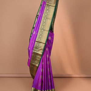 Purple zari buttas silksaree, contrast jaal pallu & border of thilakam,neli,kathir,kodi visiry & mayil kann