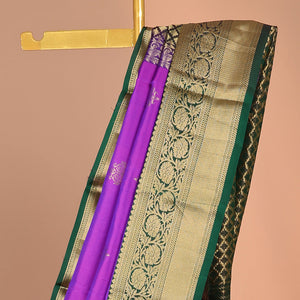 Purple zari buttas silksaree, contrast jaal pallu & border of thilakam,neli,kathir,kodi visiry & mayil kann