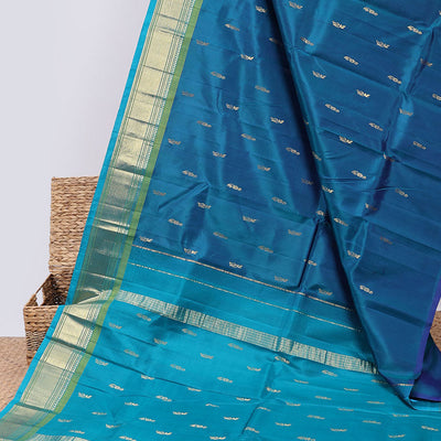 Blue buttas kancheepuram silksaree, zari design pallu & contrast border of panner sombu,banaras,muthu,mayil kann