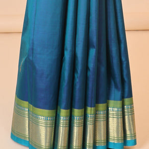 Blue buttas kancheepuram silksaree, zari design pallu & contrast border of panner sombu,banaras,muthu,mayil kann