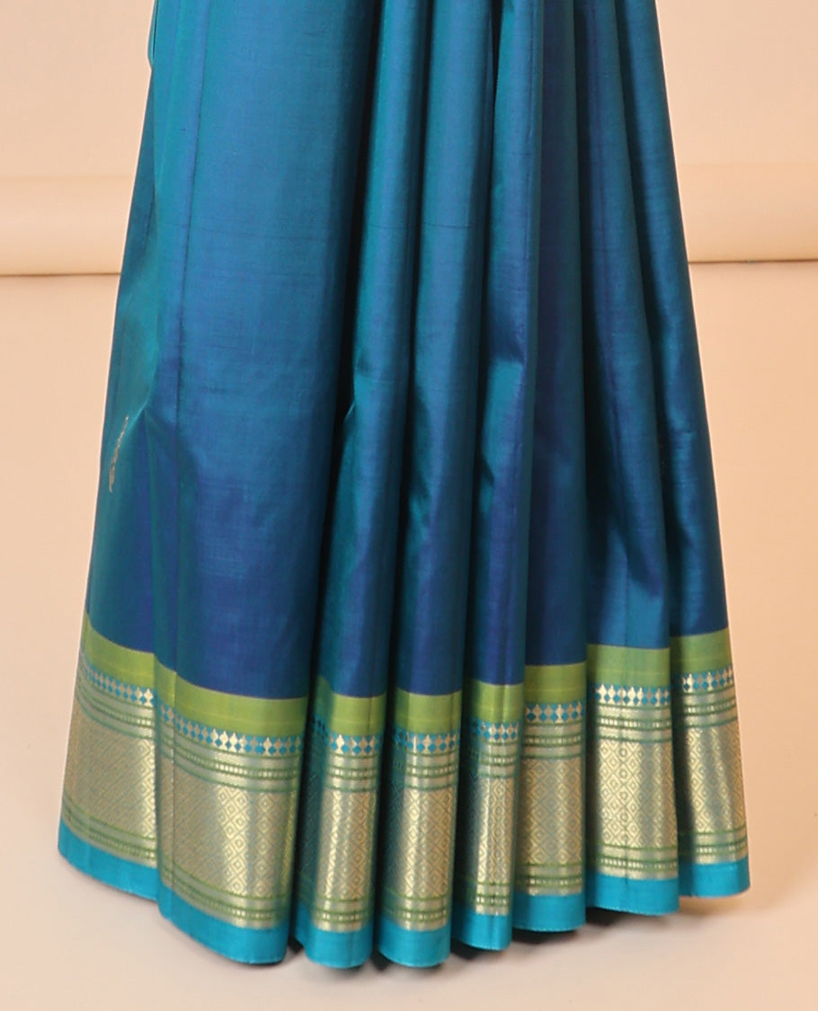 Blue buttas kancheepuram silksaree, zari design pallu & contrast border of panner sombu,banaras,muthu,mayil kann