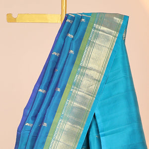 Blue buttas kancheepuram silksaree, zari design pallu & contrast border of panner sombu,banaras,muthu,mayil kann